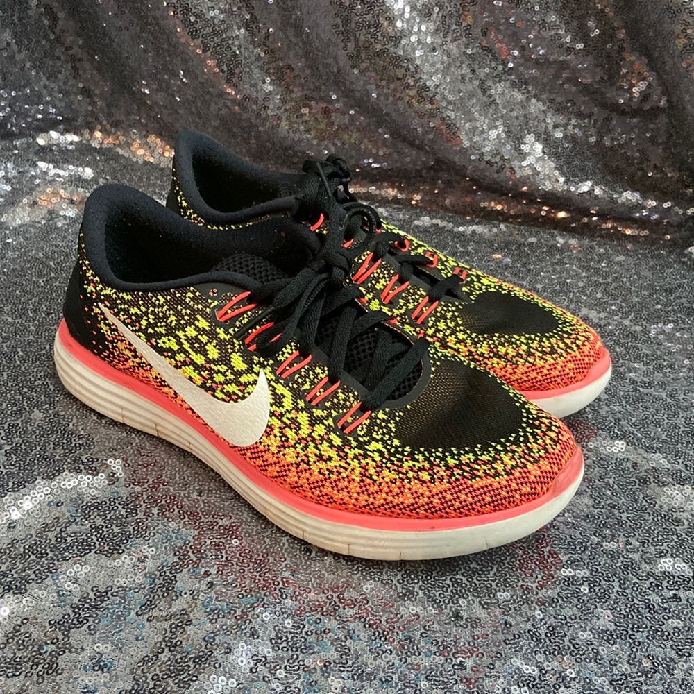 Women’s Nike neon yellow and pink running shoes size 8.5